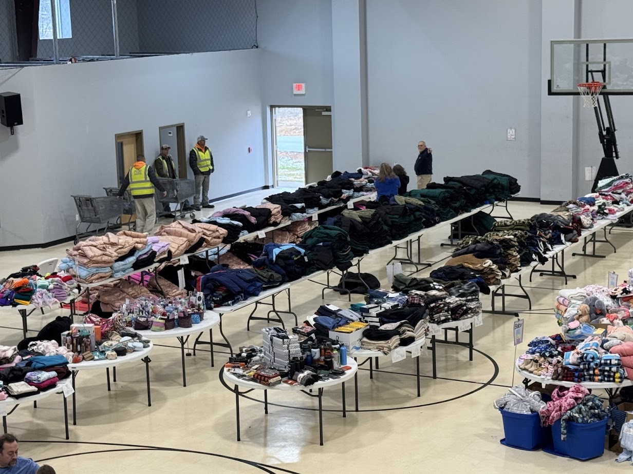 Clothing and supplies on donation tables